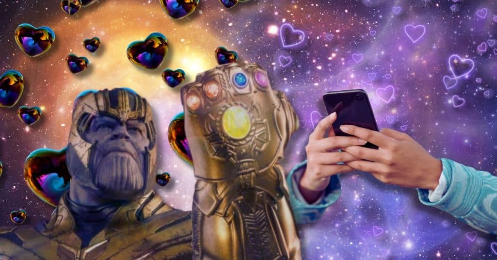 thanos with infinity gauntlet and hands holding phone with galaxy and heart in the background