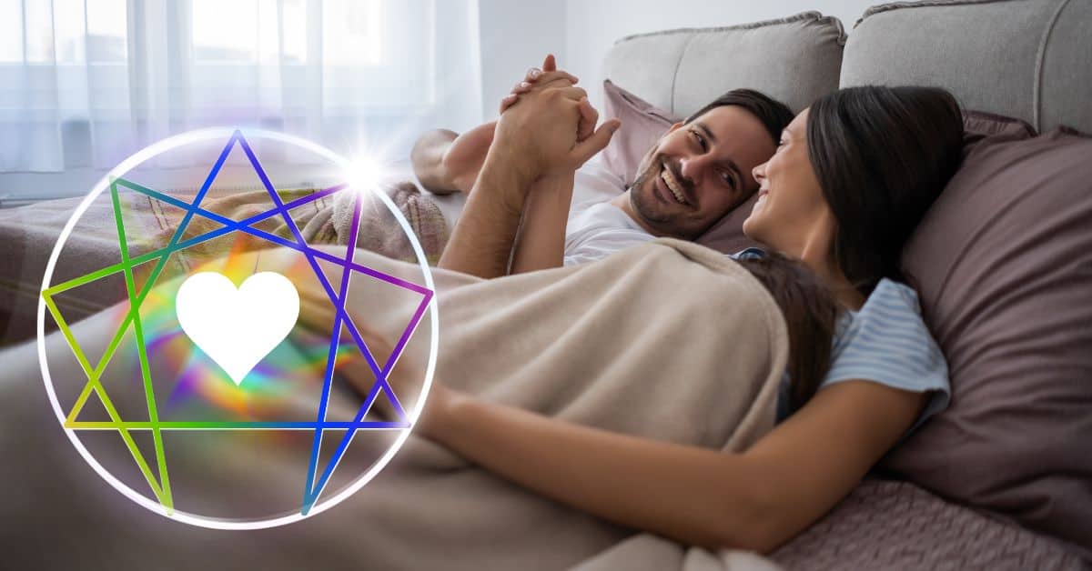 couple holding hands in bed with rainbow enneagram symbol next to them