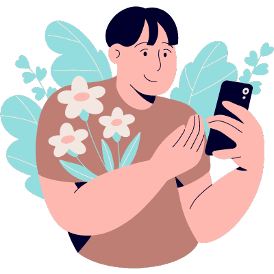 man looking at phone with flowers around him