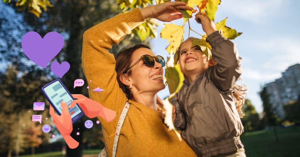 woman with daughter and smartphone with hearts