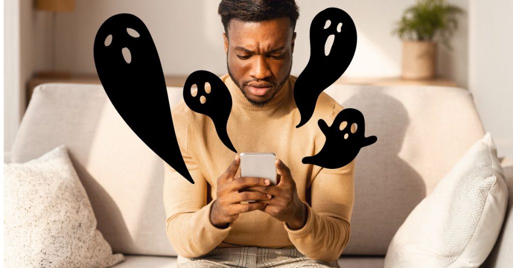 man frowning at phone with ghost icons around him