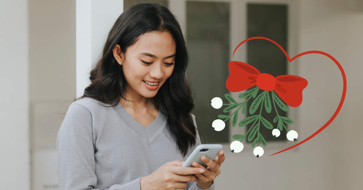 woman looking at phone during the holidays